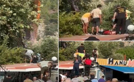 Fethiye'de yamaç paraşütü ağaca takılınca işletmenin çatısına indi: 1 yaralı